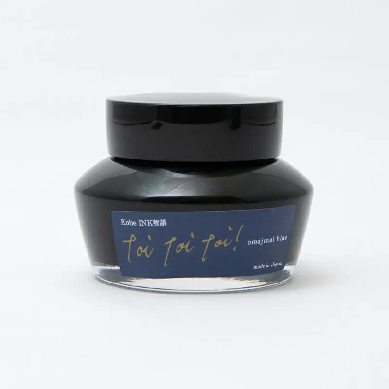 Kobe INK Monogatari Omajinai Blue fountain pen ink in a 50ml glass jar with a black lid.