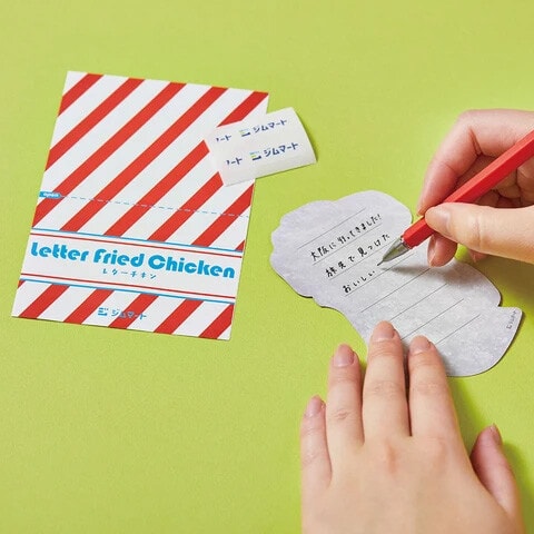 Person writing on King Jim's cute japanese stationery
