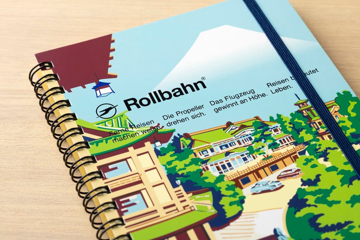 Rollbahn spiral notebook featuring a colorful Japanese landscape illustration with Mount Fuji and traditional architecture.